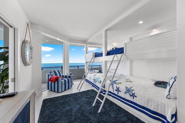 bedroom featuring a water view