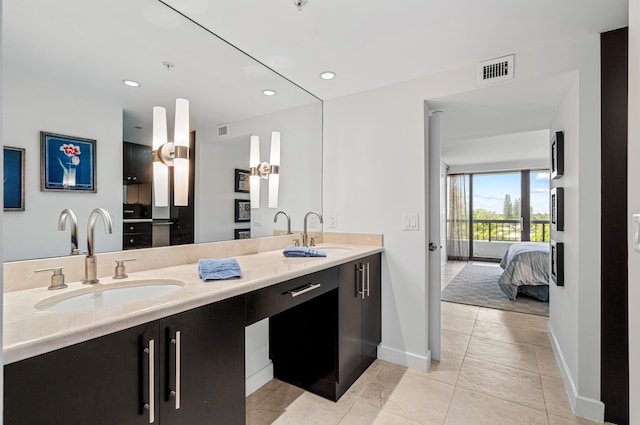 bathroom with vanity and tile patterned flooring