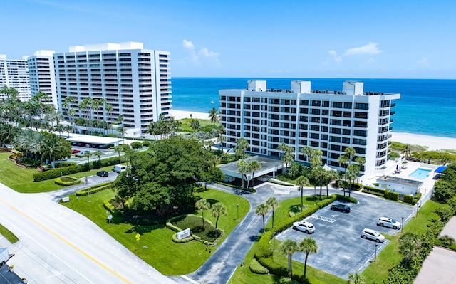 aerial view with a water view and a view of the beach