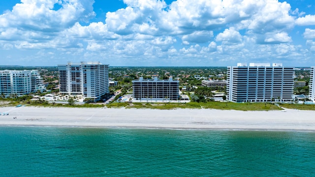 aerial view featuring a water view and a view of the beach