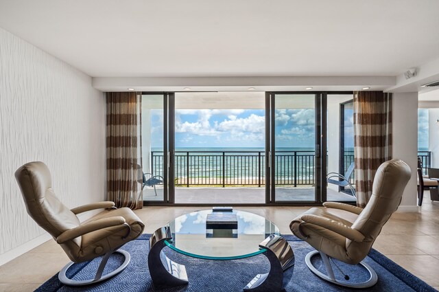 1800 S Ocean Blvd Unit 5C, Boca Raton, FL 33432 - sitting room featuring tile patterned floors and a water view