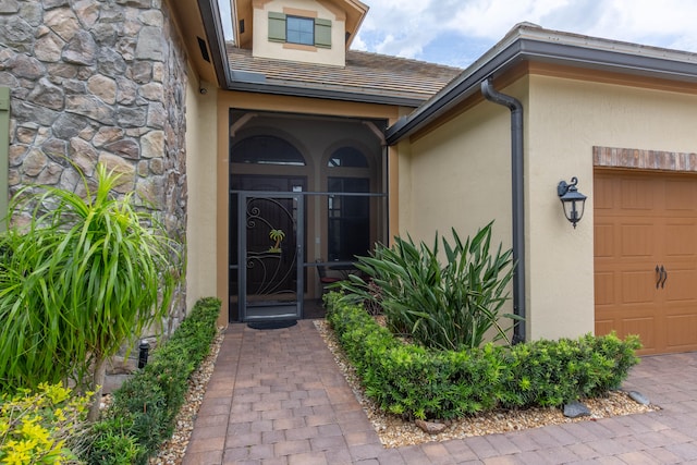 entrance to property featuring a garage