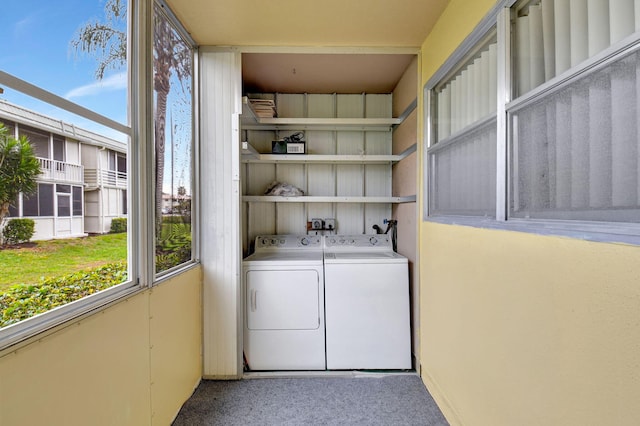 washroom featuring washing machine and clothes dryer