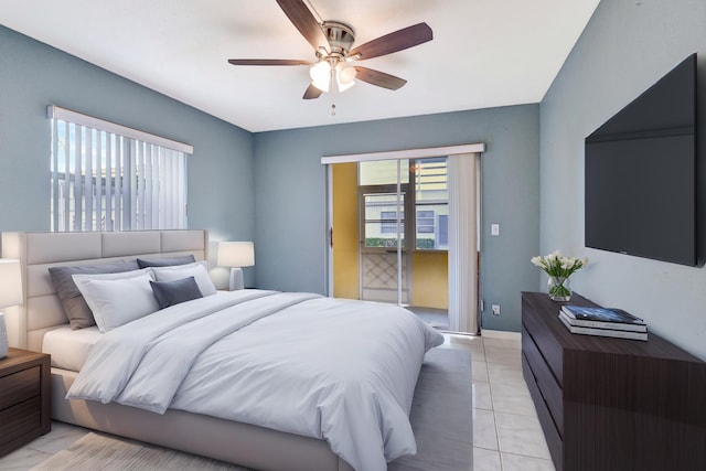 bedroom with ceiling fan, light tile patterned floors, and access to outside