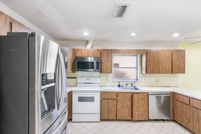 kitchen featuring appliances with stainless steel finishes and sink