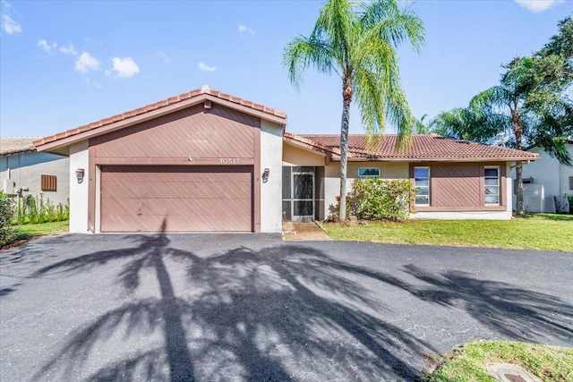 ranch-style home with a garage