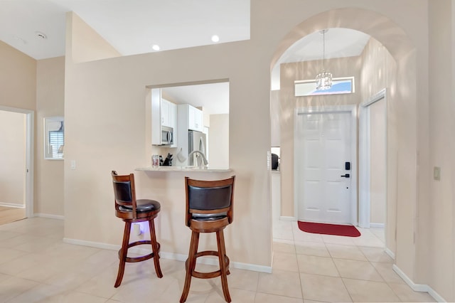 entrance foyer featuring light tile patterned flooring