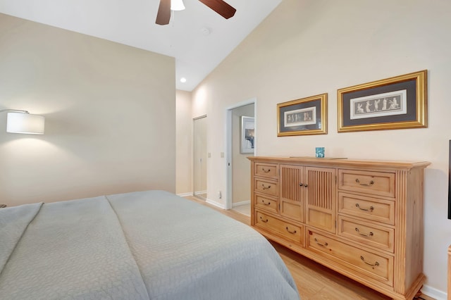 bedroom with lofted ceiling, light hardwood / wood-style flooring, and ceiling fan