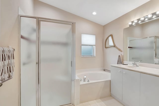 bathroom featuring vanity, separate shower and tub, and lofted ceiling