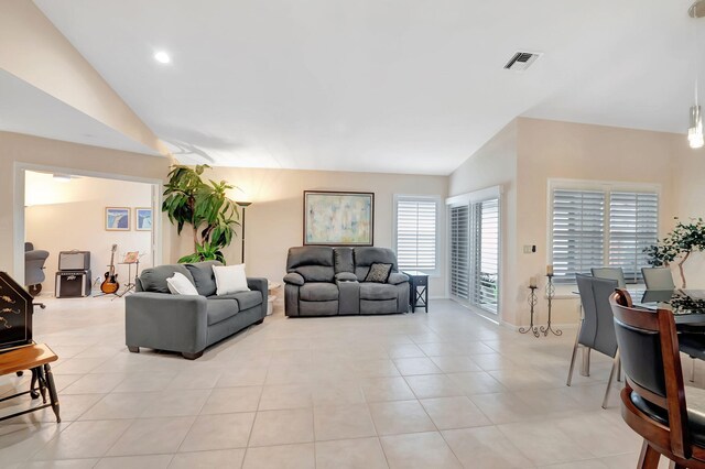 tiled living room with lofted ceiling