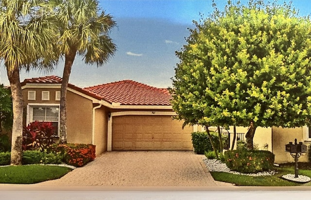 view of front of property with a garage