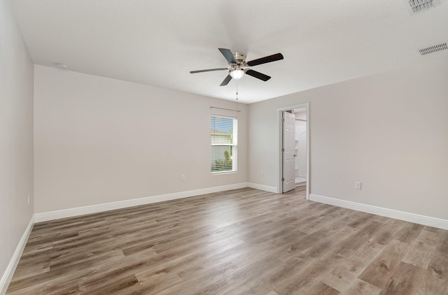 empty room featuring light hardwood / wood-style floors and ceiling fan