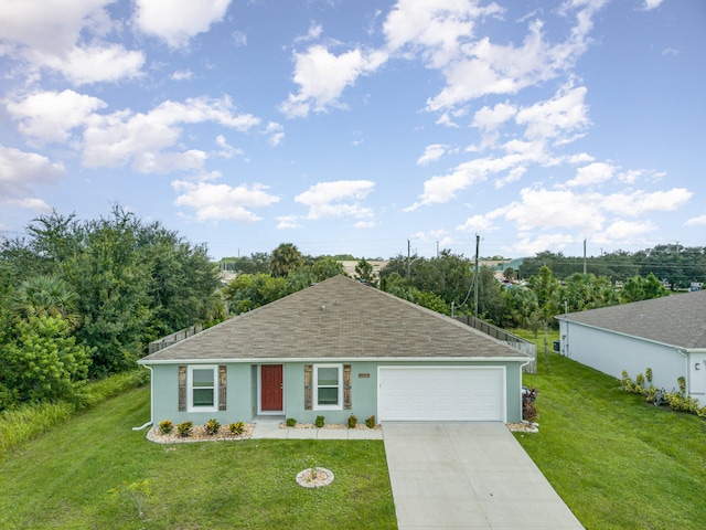 ranch-style house with a garage and a front lawn