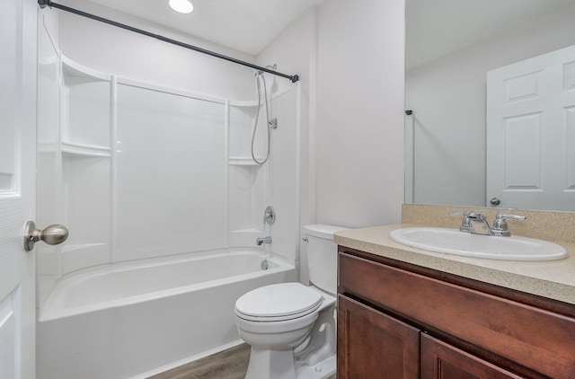 full bathroom with vanity, hardwood / wood-style flooring, toilet, and bathtub / shower combination