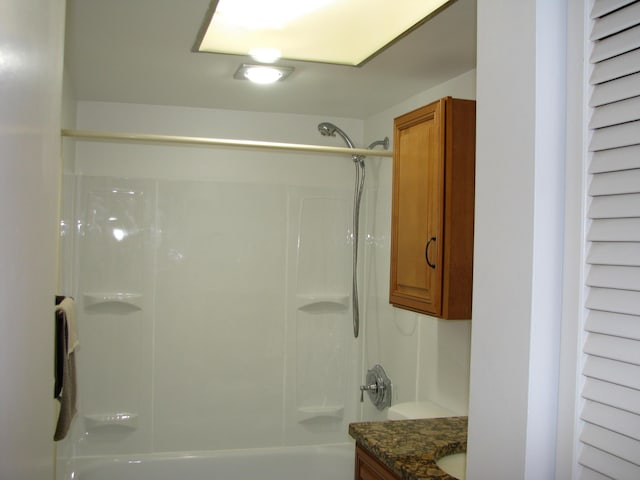 bathroom featuring vanity and shower / bath combination