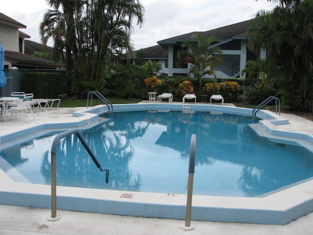 view of swimming pool with a patio area