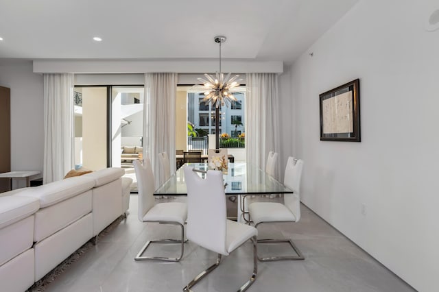 dining space with an inviting chandelier