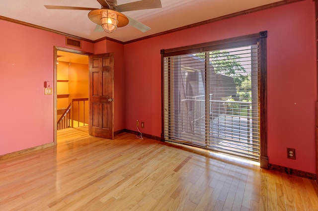 spare room featuring light hardwood / wood-style flooring, ceiling fan, and crown molding