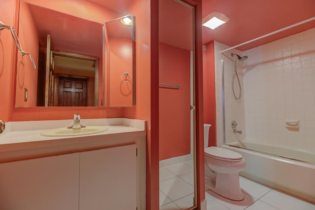 full bathroom with tile patterned flooring, vanity, toilet, and tiled shower / bath