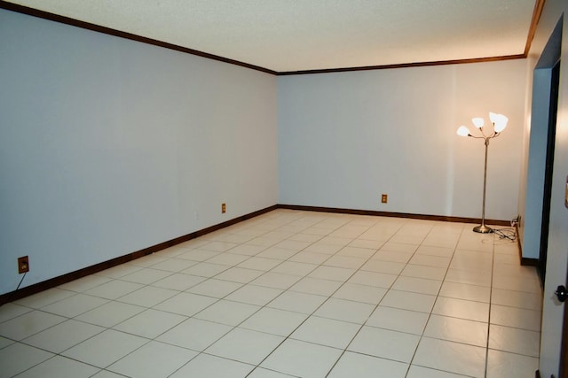 unfurnished room with crown molding, light tile patterned floors, and a textured ceiling