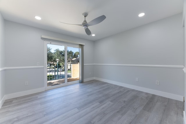 spare room with ceiling fan and light hardwood / wood-style flooring