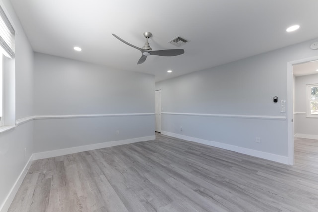 unfurnished room featuring ceiling fan and light hardwood / wood-style floors