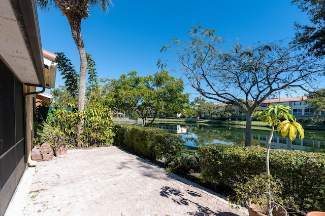 view of patio with a water view