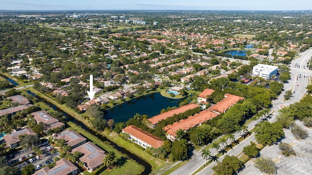 birds eye view of property featuring a water view