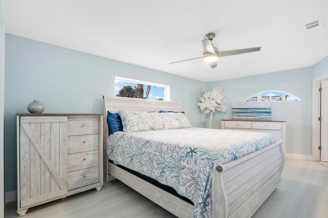 bedroom featuring light hardwood / wood-style floors and ceiling fan