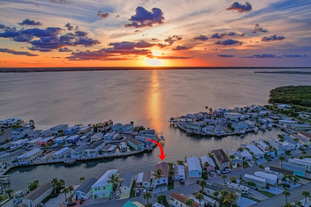 aerial view at dusk with a water view