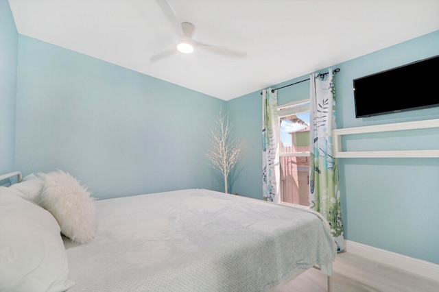 bedroom featuring ceiling fan and light hardwood / wood-style floors