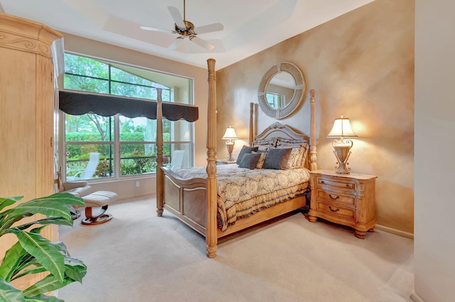 bedroom featuring ceiling fan and light colored carpet