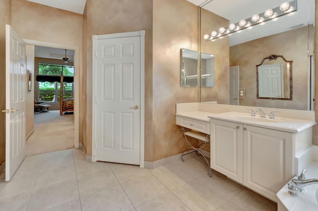 bathroom with vanity, ceiling fan, tile patterned floors, and a tub