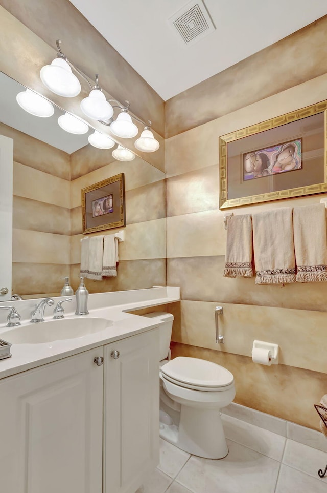 bathroom featuring vanity, toilet, and tile patterned floors