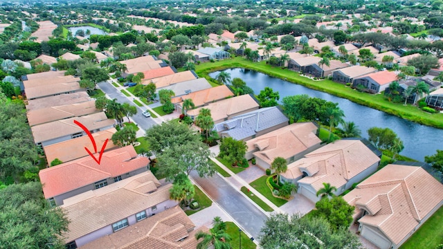 birds eye view of property with a water view