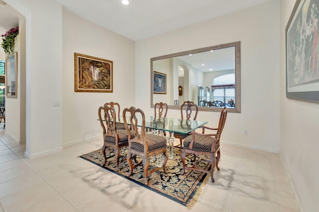 dining space featuring light tile patterned floors