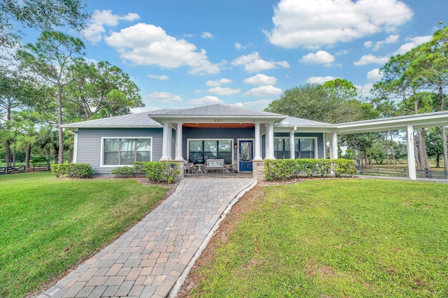 view of front of property featuring covered porch and a front yard