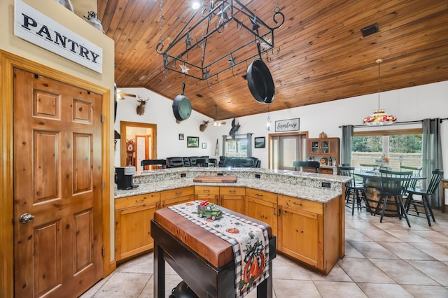 kitchen featuring kitchen peninsula, light stone counters, high vaulted ceiling, wooden ceiling, and hanging light fixtures