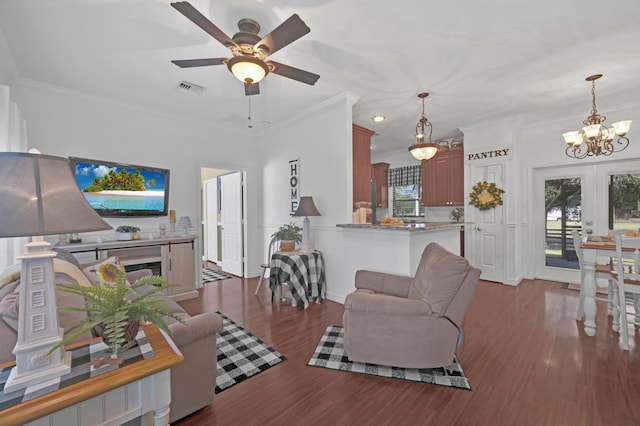 living room featuring french doors, ornamental molding, and hardwood / wood-style flooring