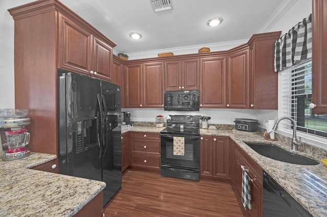 kitchen with light stone counters, crown molding, sink, black appliances, and dark hardwood / wood-style floors