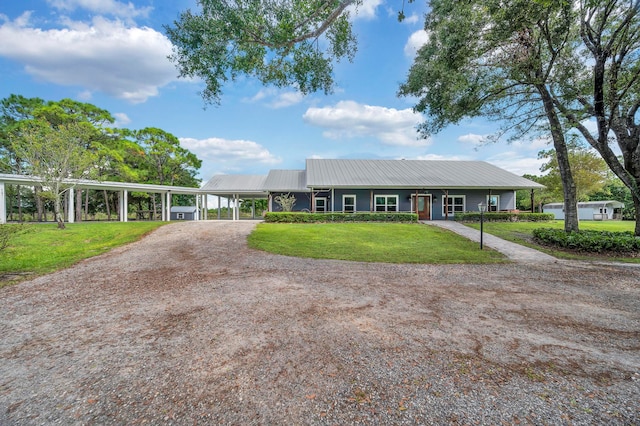 ranch-style house with a front lawn and a carport