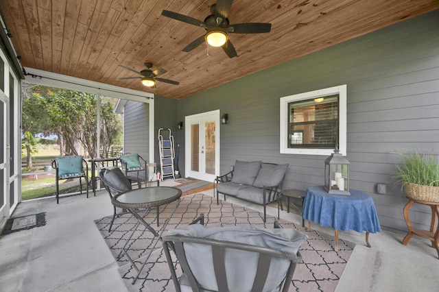 exterior space with ceiling fan and wood ceiling