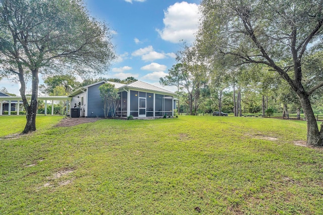 view of yard with a sunroom