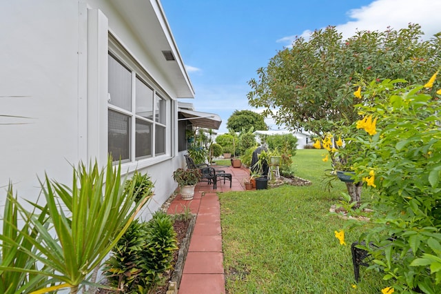 view of yard with a patio area