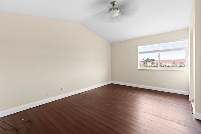 empty room featuring ceiling fan, dark hardwood / wood-style flooring, and lofted ceiling