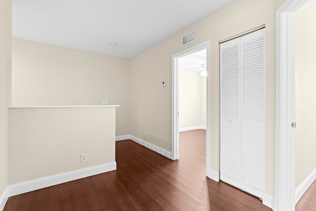 hallway featuring dark hardwood / wood-style floors