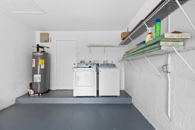 laundry area with washer and dryer and electric water heater