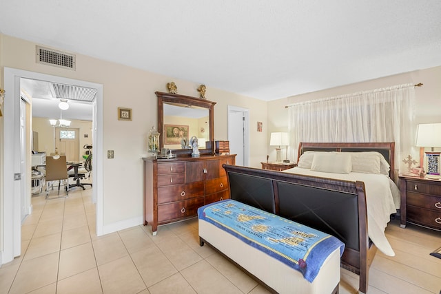 bedroom with light tile patterned floors