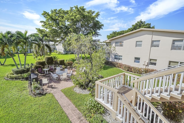 exterior space featuring a deck and a patio area