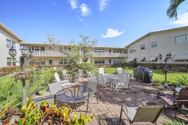 view of patio / terrace with a balcony and grilling area